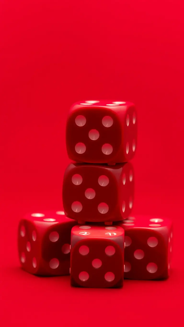 Stacked Red Dice on Red Background Gradient